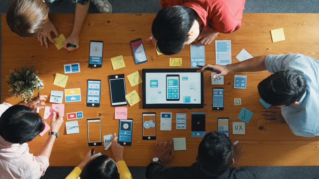 top view software developer team looking ux design from tablet convocation